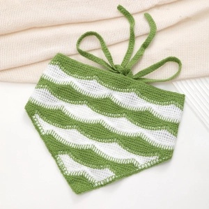 Detail of green and white wavy crochet knit headscarf texture with hand-knitted straps