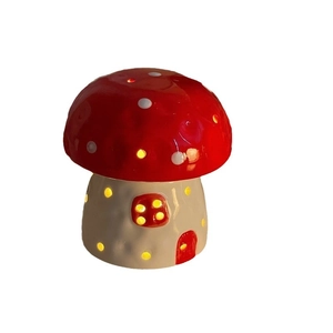Creative ceramic mushroom night light with red polka dot cap and warm glowing window