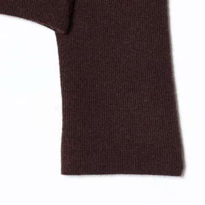 Close-up of deep coffee slim fit long sleeve knit top with smooth finished cuffs