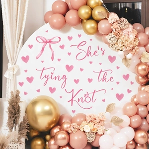 Pink bow and heart PVC stickers with 'She's tying the Knot' text for wedding backdrop décor