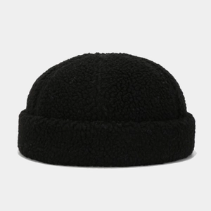 Close-up of black fleece docker hat showing soft sherpa texture and premium stitching