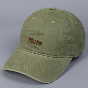 Detailed view of More embroidery on vintage washed green cotton baseball cap