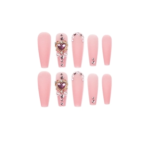 Pink press-on nails with purple heart crystal and pearl accents, long coffin shape