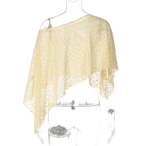 Detail of light yellow lace shawl showing intricate hollow patterns and asymmetric shoulder cut