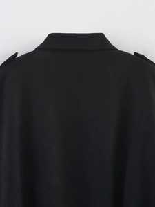 Close-up of black suede pilot jacket featuring turn-down collar and shoulder epaulettes