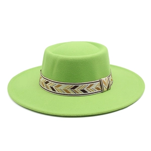 Detailed view of neon green wool felt hat with ethnic geometric patterned ribbon band