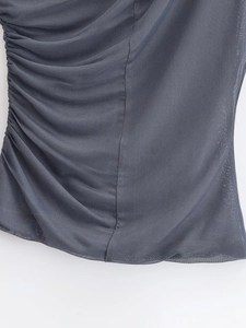 Detailed close-up of dark grey mesh fabric featuring lateral ruched stitching details
