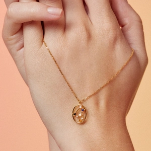S925 sterling silver zodiac necklace featuring colorful gemstones on an oval gold pendant