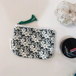 Floral cotton pouch with green tassel zipper for makeup and small essentials