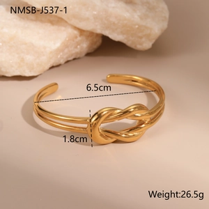 Detail view of 18K gold-plated stainless steel cuff bracelet with precise dimensions