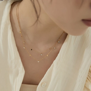 Double-layered titanium steel necklace with gold teardrop and triangle zirconia pendants