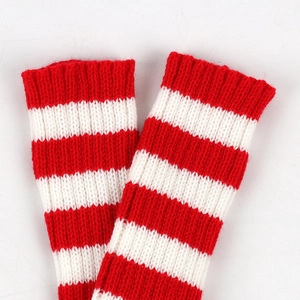 Detailed knit texture of red and white striped arm warmers with premium finish