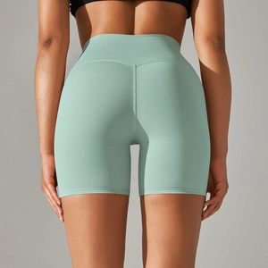 Detailed back view of high-waist mint green yoga shorts showing butt-lifting seam and fit