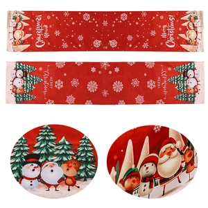 Christmas table runner featuring festive prints of Santa, Snowman, and Reindeer motifs