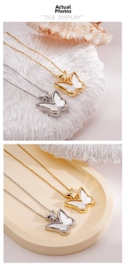 Detail of 18K gold-plated double butterfly necklace with iridescent mother of pearl pendants