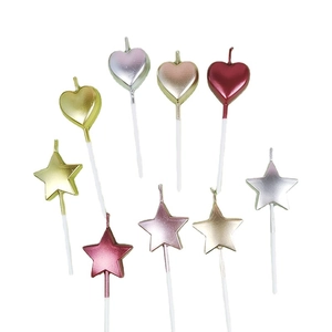 Set of heart and star birthday candles in metallic gold silver and rose gold colors