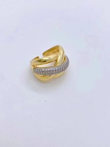 Close-up of golden multi-layer crisscross ring with micro-pave white zircon inlay
