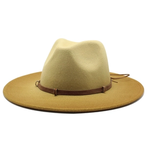 Two-tone wool fedora hat in khaki and caramel with a buckled leather band on white background