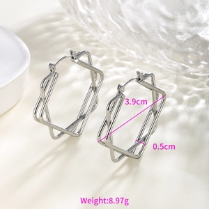 Detail view of silver hexagonal overlapping hoop earrings with 3.9cm diameter
