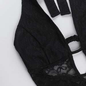 Detailed close-up of intricate black floral lace pattern and hollow strap design