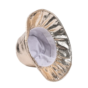Detail of gold metallic coated bucket hat showing glossy texture and interior white lining