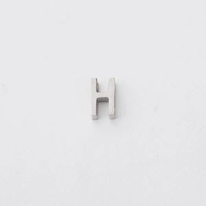 Close-up of polished stainless steel letter H pendant bead with 1.8mm small hole