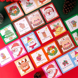 Close-up of assorted 3D Christmas greeting cards featuring Santa Claus and reindeer designs