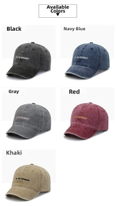 Detail showing various colors of washed cotton baseball caps with In The Moment embroidery