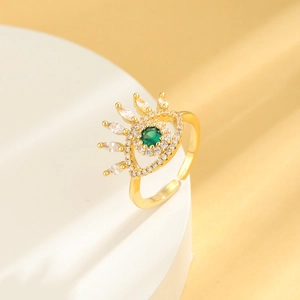 Adjustable evil eye ring in gold plating with a green stone and white zircon accents