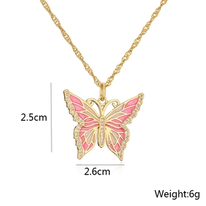 Detailed size view of a gold-plated butterfly pendant with pink enamel and zircons