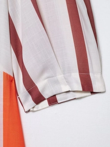 Close-up of striped sundress fabric showing high-quality stitching and breathable texture