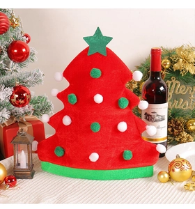 Detail of red Christmas tree hat with colorful plush balls in festive party scene setting
