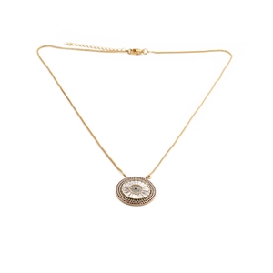 Detail of gold evil eye pendant necklace with colorful cubic zirconia on white background