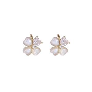Elegant gold clover stud earrings with white cat eye stone and sparkling crystals