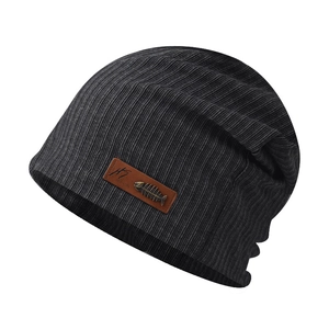 Dark grey slouchy beanie with fishbone pendant and leather patch on white background