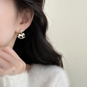 Elegant gold horse stud earrings with white pearls and sparkling zircons for women