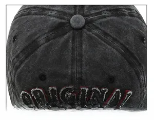 Détail macro des coutures à six panneaux et de la broderie ORIGINAL sur casquette en jean