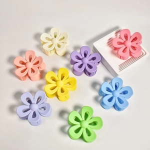 Matte finish large flower hair claws in multiple pastel colors on white background