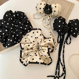 Polka dot hair scrunchies and bow claw clips with pearl edges for elegant women hair styling