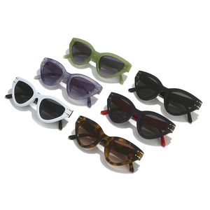 Cat eye triangle frame sunglasses in six vibrant colors including green and tortoiseshell