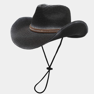 Detail of black woven cowboy hat with studded brown band and adjustable chin strap