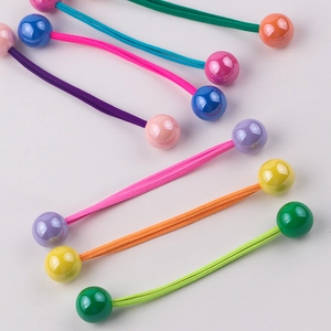Detail shot of colorful double ball hair ties for girls with elastic fiber bands