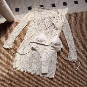 Three-piece white lace bikini set with long-sleeve mesh cover-up and high-waist bottoms