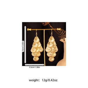Detailed view of bohemian layered gold shell tassel earrings with size and weight info