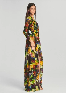 Detailed side view of long sleeve V-neck floral dress with high slit and vibrant prints