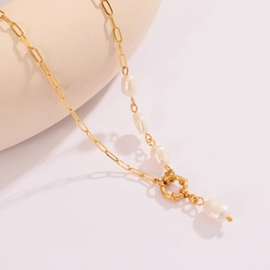 Detail of 18K gold paperclip chain necklace with a unique white baroque pearl pendant
