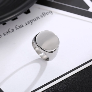 Polished silver stainless steel oval signet ring shown from a 45-degree angle