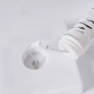 Close-up of the white base assembly and connector for the birch tree LED lamp