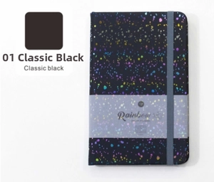 Detailed view of A5 black hardcover notebook with rainbow starlight and elastic band