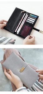 Detail of matte long wallet interior card slots and foldover clasp in black and grey